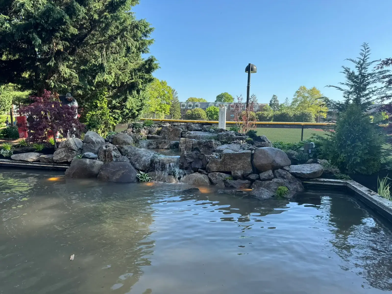 Rock waterfall built into the campus reflecting pond at Adelphi University in Garden City