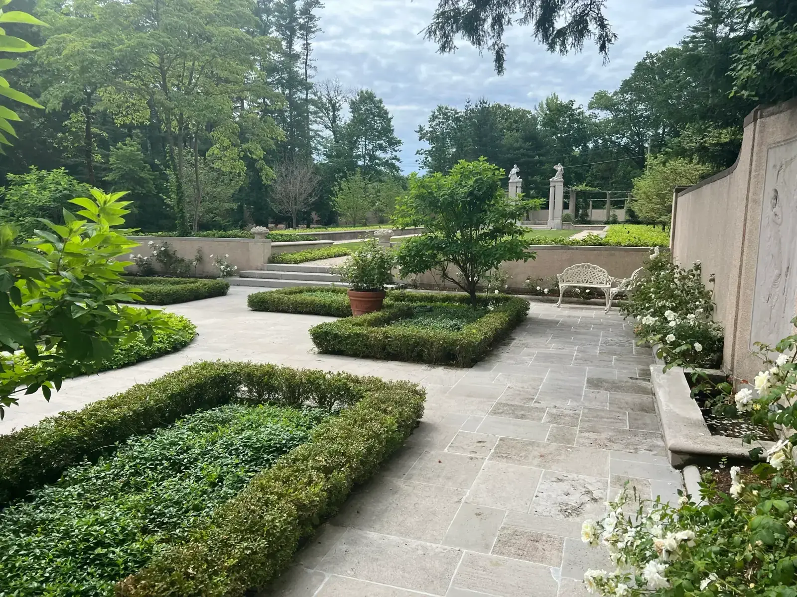 Formal boxwood parterre with bluestone paths