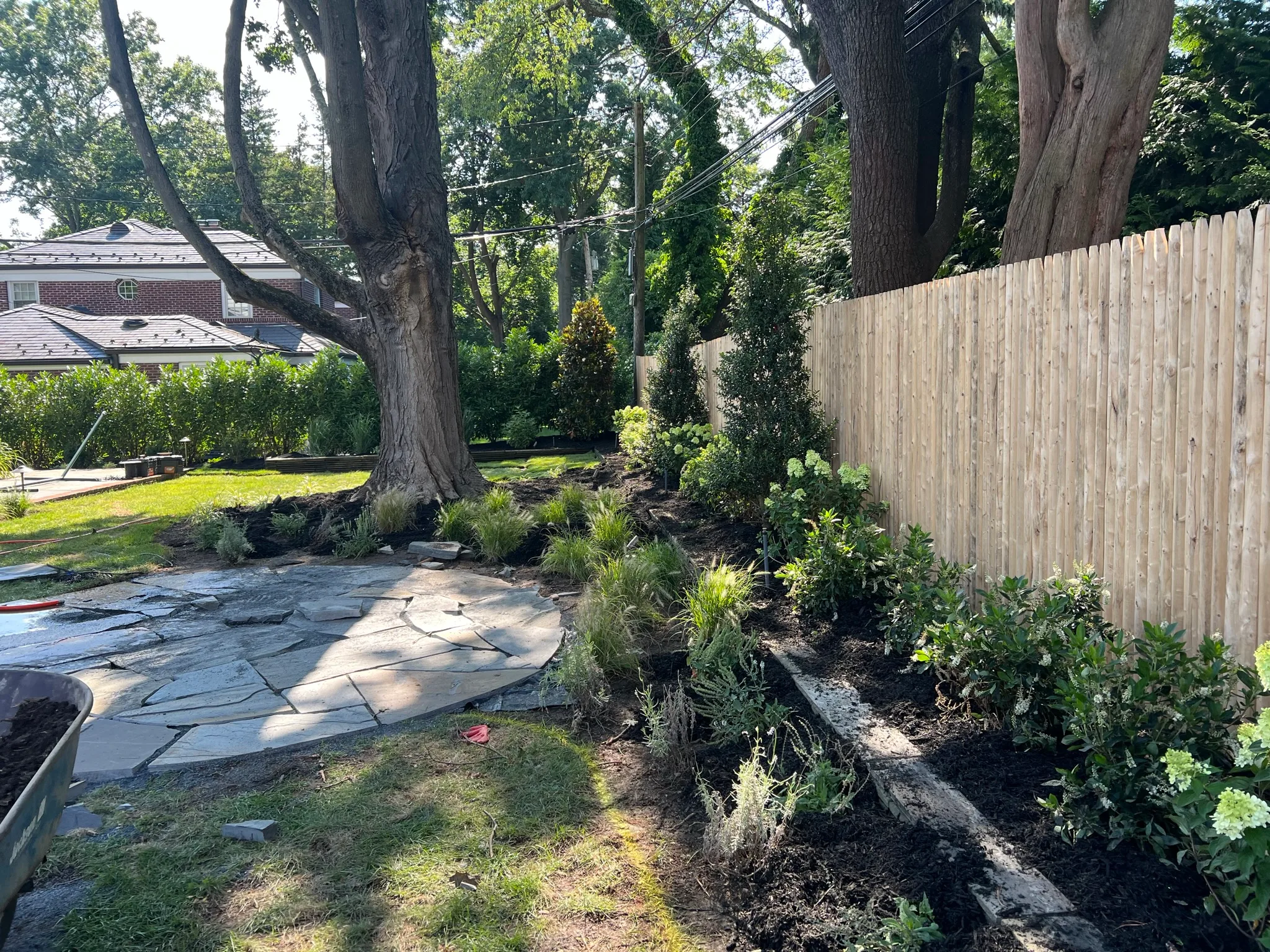 CS7 — rear flagstone patio and garden beds
